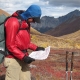 Navigating around Alaska, the old-fashioned way, with an 11"x17" USGS map (created with National Geographic TOPO! software) and a simple baseplate compass (located in my side pocket, attached via the lanyard to my shoulder strap).