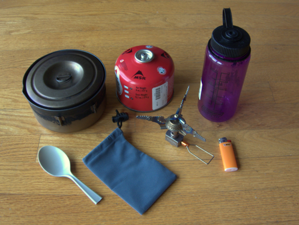 My stove system for solo backpacking trips in the shoulder seasons, when I'm willing to carry a few extra ounces so that I can quickly heat up large amounts of water. With a larger pot and an additional eating container, mug, and utensil, this system would be suitable for couples, too.