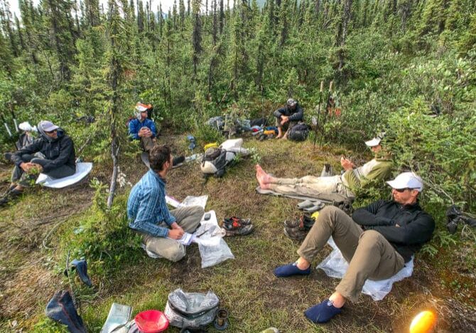 Gathering client feedback about their footwear choices while waiting for our bush plane at Circle Lake, Brooks Range, Alaska. Photo: Dave Eitemiller.